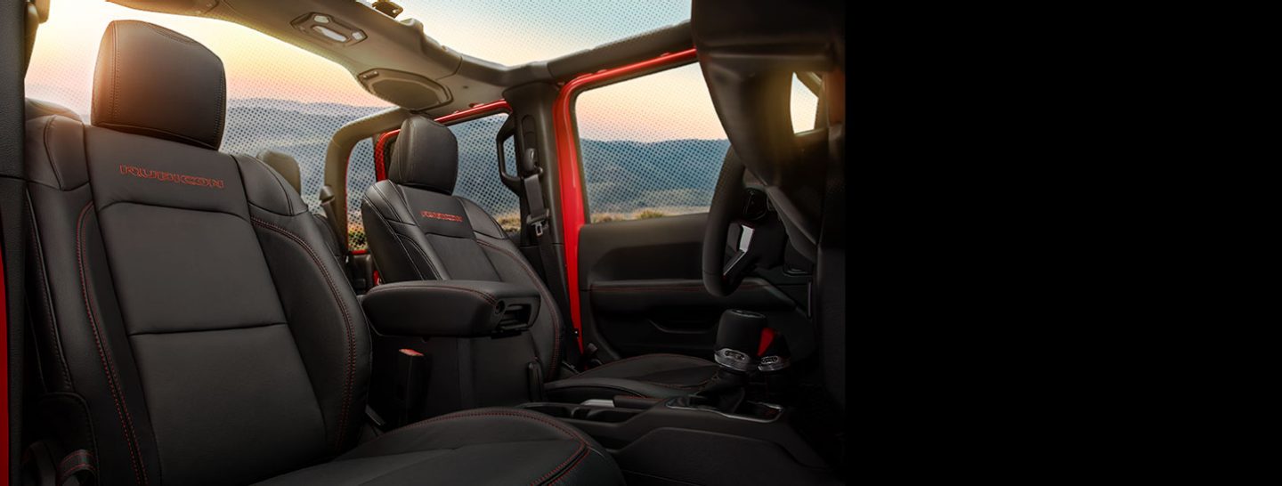 Front seats of a red Gladiator Rubicon as seen from passenger side