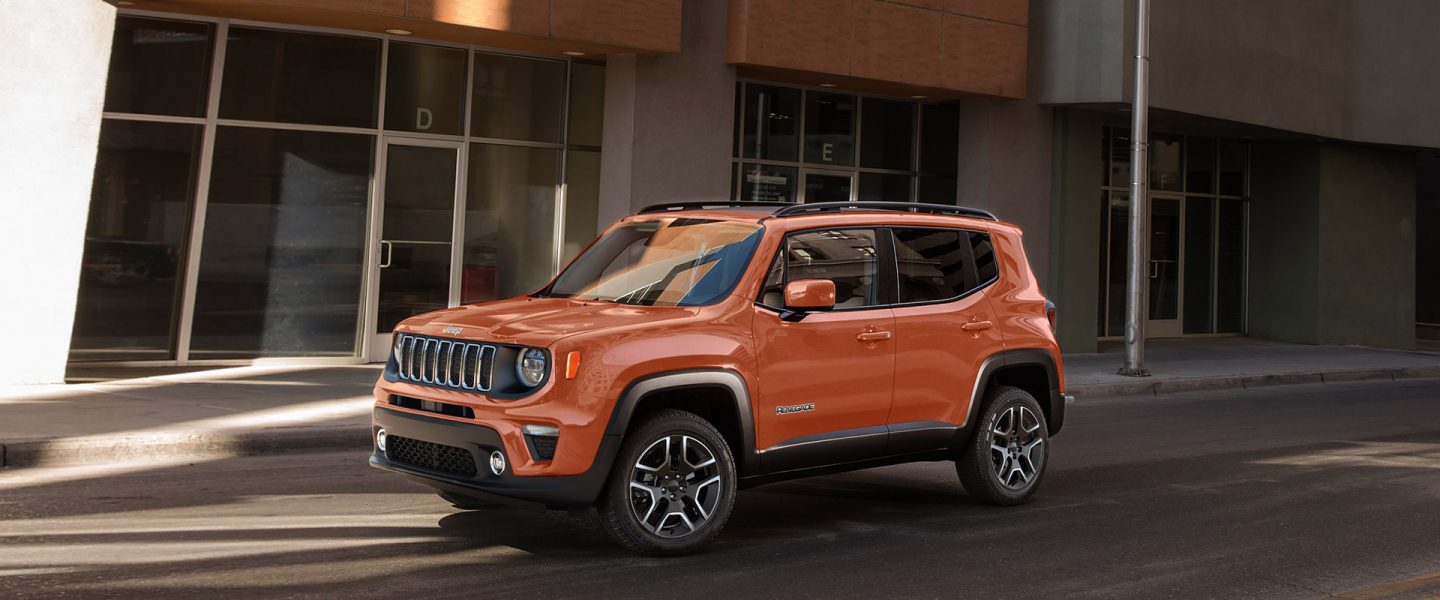 The 2020 Jeep Renegade parked on a city street, in a commercial district.