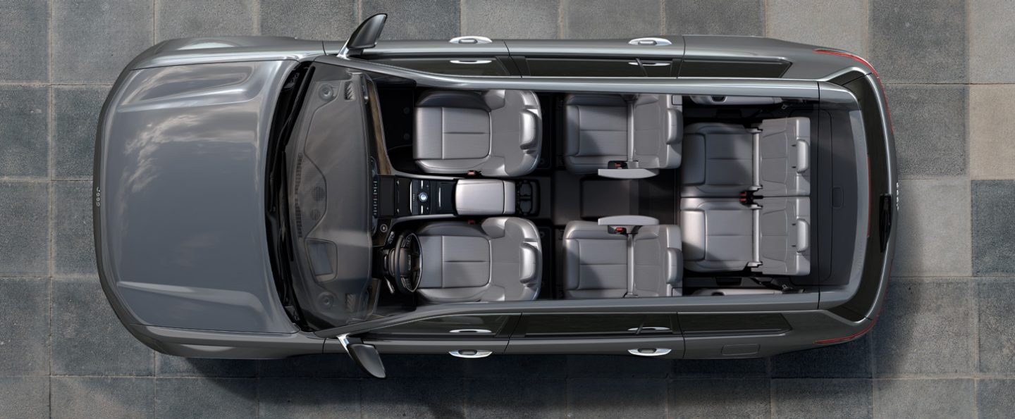 A bird's eye view of a 2021 Jeep Grand Cherokee L with the roof removed, displaying the six-passenger seating in gray.