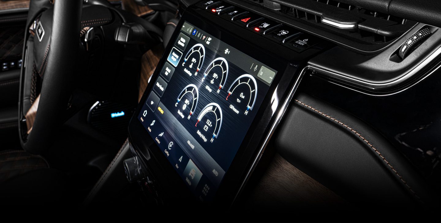 An angled view of the Uconnect touchscreen in the 2022 Jeep Grand Cherokee L.