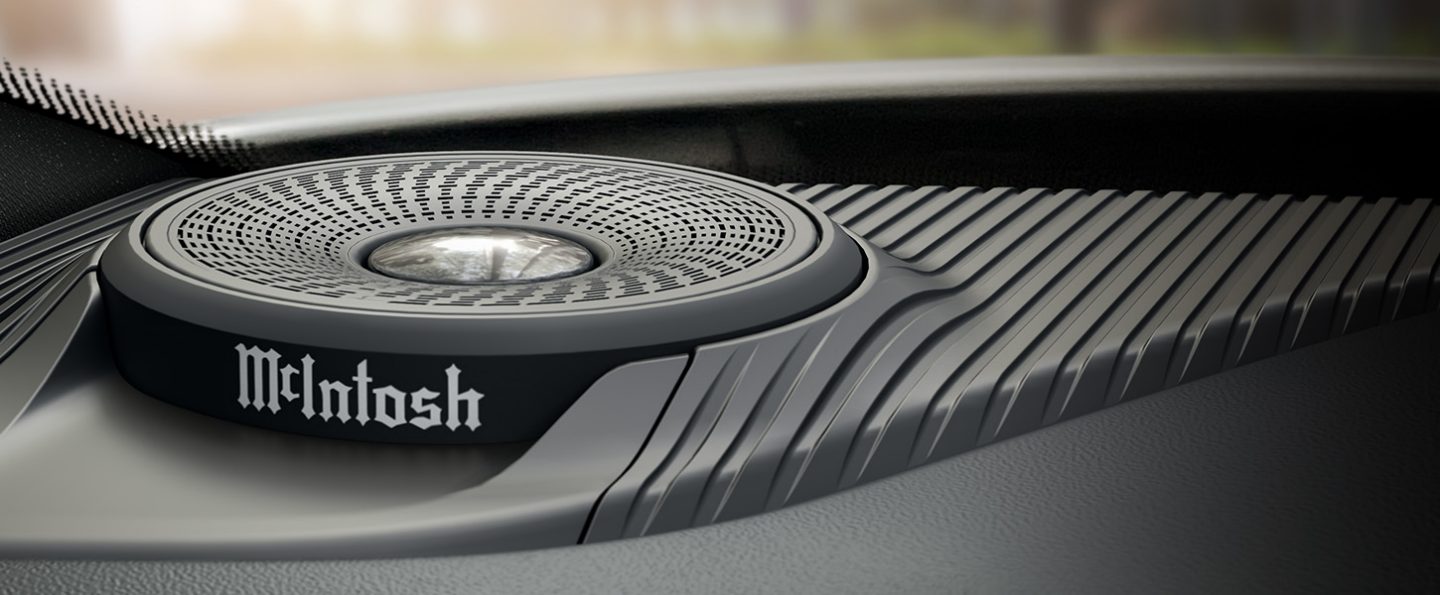 A detailed view of a McIntosh Audio speaker on the driver side dash inside the 2022 Jeep Grand Cherokee.