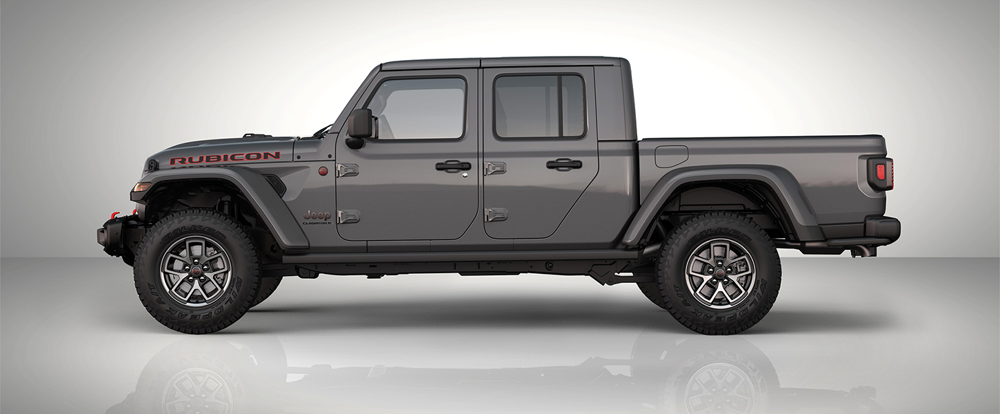 A slider that when pulled to the right reveals an exterior driver-side profile of a gray 2025 Jeep Gladiator Rubicon X. And when pulled to the left reveals an under-the-skin driver-side profile of a 2025 Jeep Gladiator.