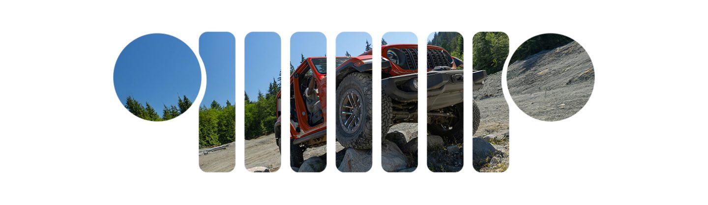 A passenger-side front angle of a red 2026 Jeep Wrangler Rubicon crawling over rocks. Over the image is a stencil of the Jeep Brand seven-slot grille.