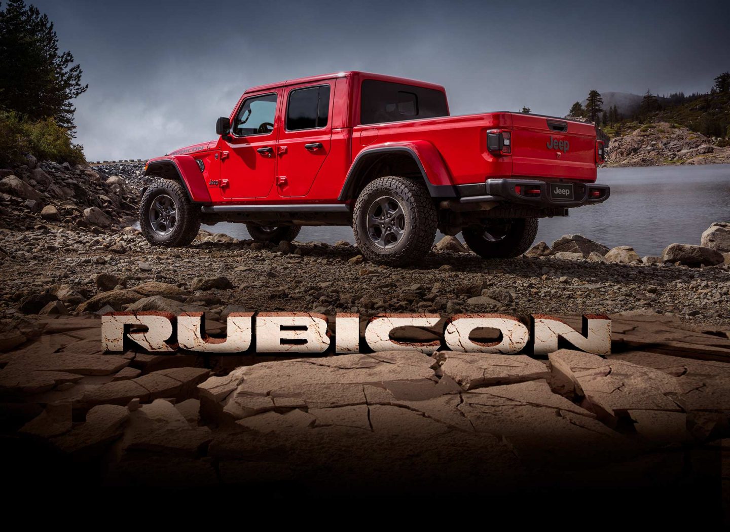 Rubicon. The 2023 Jeep Gladiator Rubicon parked on a pebbled riverbank.