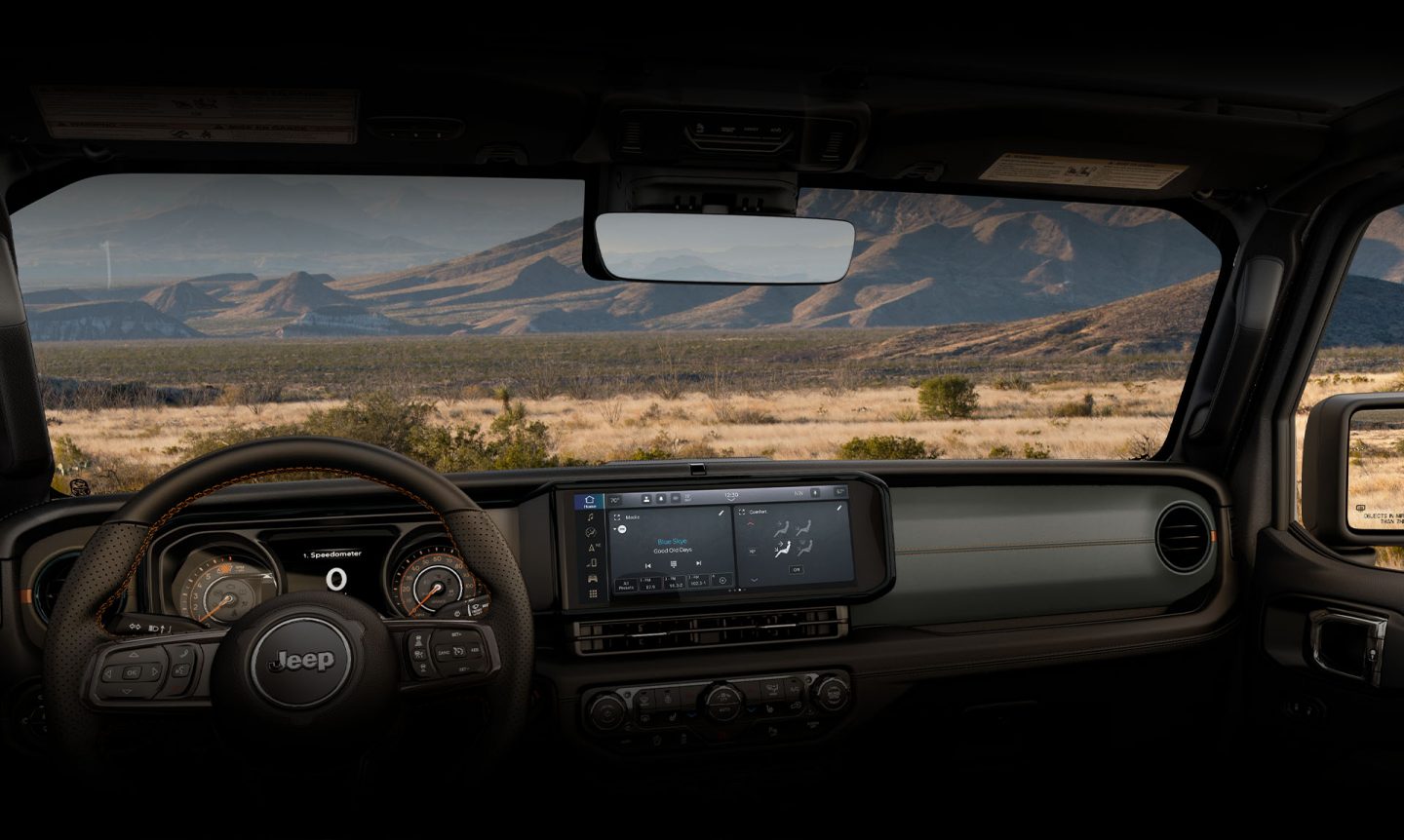 The windshield, steering wheel, Driver Information Digital Cluster and Uconnect touchscreen in the 2024 Jeep Gladiator.