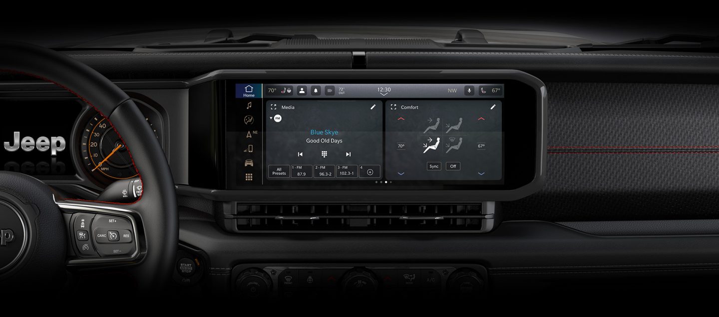 The Uconnect touchscreen in the 2024 Jeep Gladiator with a split screen displaying an audio selection on the left, and the climate controls on the right.