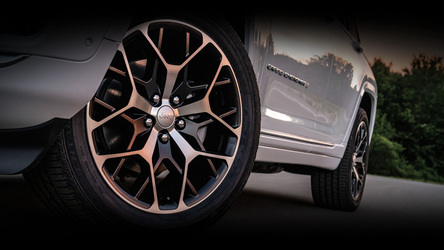 A close-up of a wheel and tire on a 2024 Jeep Grand Cherokee.