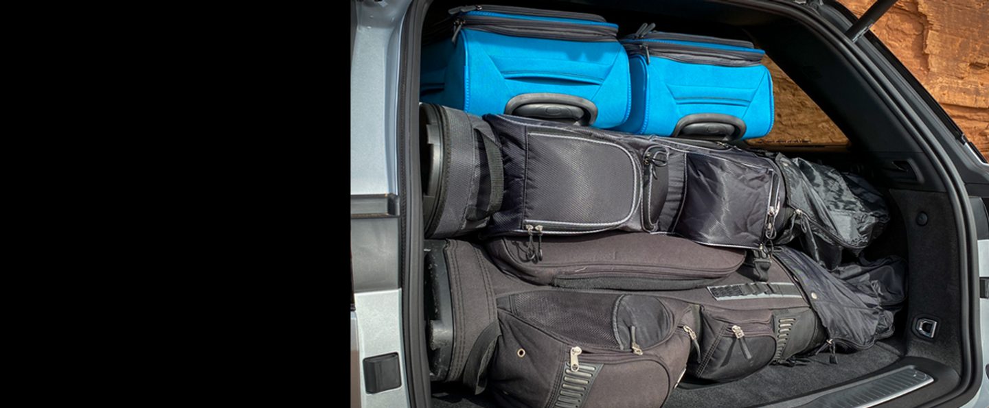 The cargo area of the 2024 Jeep Grand Cherokee loaded with luggage from top to bottom.